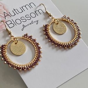 Handmade purple and gold beaded earrings